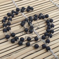 📿Karungali (black ebony wood) is a very powerful tree which our ancestors used. It was used in ancient temples and temple towers (kalasam); was also used in significant homams and other pooja rituals. Ebony Wood Mala is here to remind us to be current and clear-headed so we can make wise and informed decisions. We are being asked to seek new ways to create beauty and harmony that are sustainable for the long-term. This is a time to bring clarity to our intentions as we focus on the future.📿 ✨ Black Wooden Beads For Jewelry Making, Traditional Black Necklace With 8mm Beads, Black Wooden Beads For Meditation, Lord Durga, Tibetan Mala, Buddhist Mala, Yoga Mala, Silk Gifts, Mala Meditation