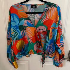 Vici Tropical Print Top With Bottom Adjustable Tie. Size Medium, But The Bottom Tie Makes It Super Adjustable. Has A Snap Closure On The Chest. Brand New, Never Worn! Open To Offers! Leave Any Questions Below! Tropical Long Sleeve Top For Day Out, Multicolor Long Sleeve Tops With Tropical Print, Blue Long Sleeve Tops With Tropical Print, Tropical Multicolor Long Sleeve Blouse, Blue Long Sleeve Top With Tropical Print, Multicolor Tropical Long Sleeve Blouse, Multicolor Long Sleeve Tropical Blouse, Blue Tropical Print Long Sleeve Top, Trendy V-neck Tropical Print Top