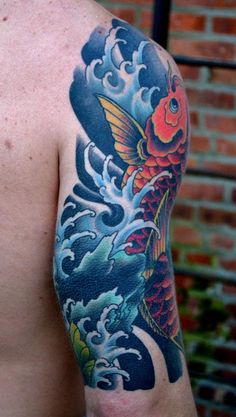 a man with a tattoo on his arm has a koi fish in the water