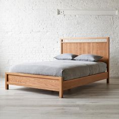 the bed is made up and ready for someone to use it in their home or office