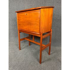 an old fashioned wooden desk with drawers