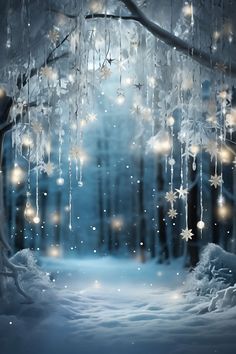 a winter scene with snowflakes hanging from the trees and lights on the branches