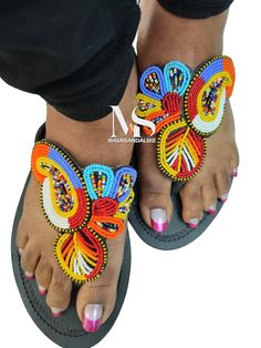 100% handmade using leather and fine beads. Masai beaded sandals are made using the pure original leather and quality African beads.They are inspired by the Masai community They are perfect for any occasion. True to size. We ship worldwide. Feel free to send me a convo for any clarifications Handmade Sandals For Summer, Handmade Open Toe Flip Flops For Spring, Multicolor Round Toe T-strap Sandals For Vacation, Beaded T-strap Sandals For Beach, Handmade Casual Flip Flops With Single Toe Strap, Handmade Casual Flip Flops, Beaded Adjustable T-strap Sandals, Multicolor Toe Loop Sandals For Summer, Adjustable Multicolor Open Toe Flip Flops