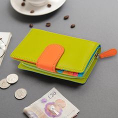 This Purse for Women is a vibrant multi-colour wallet, offering a stylish and colourful rainbow bifold wallet design by PRIMEHIDE. It's a perfect gift idea for Mom, especially for a 3rd anniversary leather gift.  DETAILS:   👜 Style: Bifold Purse 🧵 Material: Leather 🔒 RFID Protection 🔐 Secure Tab Fastener 💳 13 Card Slots 🆔 2 ID Windows 💵 Note Compartment 🧡 Zipped Coin Pocket 🎁 Gift Boxed 📏 DIMENSIONS: Size: 9 x 14 x 4 cm ⚖️ WEIGHT: 200g HOW TO ORDER: Please note that colours may vary, f Modern Green Bifold Wallets, Modern Green Bifold Wallet, Green Wallets With Card Slots For Daily Use, Green Wallets With Card Slots, Green Trifold Travel Wallet, Green Daily Use Wallet With Card Slots, Multicolor Travel Wallet With Interior Card Slots, Multicolor Travel Wallet With Card Slots, Multicolor Travel Wallets With Card Slots