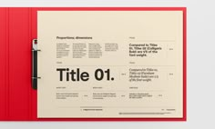 a red folder with black text on the front and back cover that reads title 01