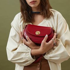 Up the ante on your style game this season with this pretty piece. Made for the modern woman, our elegant saddle bag is both daytime-worthy and after-dark appropriate. We are loving the signature gold-tone buckle which forms the focal point of this bag, and also stands out against the red finish. Keep it in the spotlight with a maxi dress in popping floral prints, leather mule pumps, and some statement jewellery.Weight: 340 gWidth (cm): 7.5 cmHeight (cm): 13 Color: RedStrap Length: 52 cmInterior Statement Jewellery, In The Spotlight, Bag Design, Retro Modern, Leather Mules, Saddle Bag, After Dark, Online Bags, Cashew