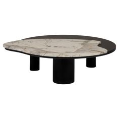 an oval marble table with black legs