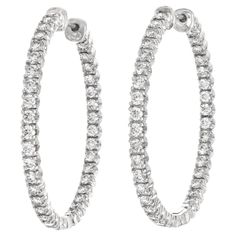 Circa 2005, 18k, by Tiffany & Co., New York. These chic diamond hoops by Tiffany & Co. are all about the diamonds! Set with 2.79 carats of brilliant white diamonds (G color VS clarity), the look is sparkling American girl glamour. At one and a half inches in diameter, they are proportioned perfectly for the ear and grab the attention of the eye tastefully. Excellent condition. Noted: Comes with an original Tiffany appraisal from 2011 Remark: "Tiffany quality, Tiffany Design …classic iconic style Tiffany And Co Earrings, Outfit Vision Board, Silver Round Earrings, Tiffany Diamond, Tiffany Jewelry, Breakfast At Tiffany's, Blessed Life, Authentic Jewelry, Rich Kids