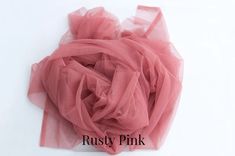 a pink tulle on a white background with the words rusty pink written below it