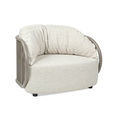 a white chair with a pillow on it's back and seat cushion in the shape of a circle