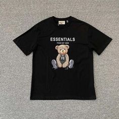 Fear Of God Essentials Teddy Bear Print Black T-Shirt New Wtih Tag Color:Black 100%Cotton Model Size:M Size Lengh 2/1chest Shoulder Sleeve S-----72cm----53cm----49cm-----22cm M-----74cm----55cm----51cm-----23cm L-----76cm----57cm----53cm-----24cm Xl----78cm----59cm----55cm-----25cm Black Tops With Logo Print For Everyday, Black Logo Print Tops For Everyday, Everyday Black Shirt With Letter Print, God Shirts, Teddy Bear Print, Fear Of God Essentials, Fear Of God, Bear T Shirt, Bear Print