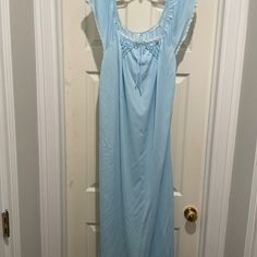 Long Blue Vintage Nightgown. Tags Have Been Cut Off But Looks Like A Medium Size. Brand And Fabric Content Is Unknown But Feels Like Nylon. I Think I May Have Gotten This From My Mother In Law's Estate. I Have Never Worn. Good Condition. Blue Nightgown For Spring Loungewear, Light Blue Summer Nightgown For Bedtime, Blue Cotton Dress For Pajama Party, Blue Nightgown For Summer Daywear, Spring Blue Nightgown For Bedtime, Light Blue Summer Sleepwear For Night, Blue Lace Trim Dress For Loungewear, Blue Nightgown For Loungewear, Summer Sleepover Light Blue Nightgown