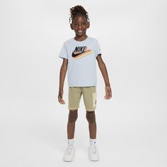 Reimagine how you dress your child for warm weather fun with this 2-piece set. The jersey knit tee has big logo love on display and the matching French Terry shorts feature a cargo pocket and a stretchy waistband for a comfy fit they can play freely in. Summer Athleisure T-shirt For Playwear, Casual Nike Tops With Pockets, Cotton Athleisure T-shirt For Playwear, Casual Moisture-wicking Short Top, Sportswear Tops For Playwear, Short Sleeve Sportswear Tops For Play, Sporty Cotton T-shirt For Playwear, Spring Short Sleeve Activewear With Letter Print, Nike Cotton Activewear With Logo Print