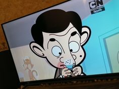 a cartoon character on the screen of a television