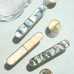 four different types of brooches sitting on top of a table