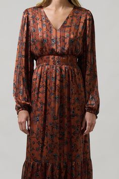 A pretty sunset and you in the Leoben Floral Kent Long Sleeve Maxi Dress, will be stunning. A lovely brown and black floral print shape this long sleeve dress with a v neckline. A back smocked waist enchants this maxi dress. You can pair it up with black boots or heels to complete the look. - Floral- V-neck- Long balloon sleeves- Smocked- Color: Brown BlackSize + Fit - Model is 5'9" and wearing size XS- Measurements taken from size S - Chest: 19 1/2"- Length: 54 1/2" Fabric Self: 100% Polyester, Pretty Sunset, Balloon Sleeve Blouse, Black Floral Print, Long Balloons, Sleeve Maxi Dress, Long Sleeve Maxi, Balloon Sleeves, Long Sleeve Maxi Dress, Black Floral