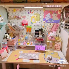 the desk has many items on it and is decorated in pink, yellow, and white