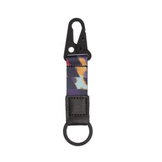 a multicolored keychain with a black metal hook on the front and bottom