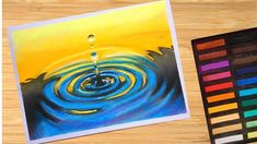 an art project with colored pencils and water