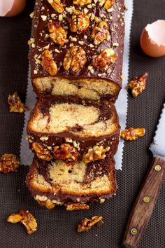 a loaf of cake with walnuts on top