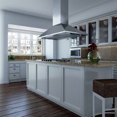 a modern kitchen with white cabinets and wood flooring