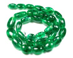 green glass beads on a white background