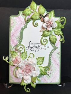 a close up of a card with flowers and leaves on the front, along with words that say always