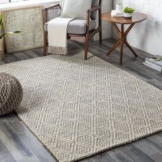 a living room area with a chair and rug