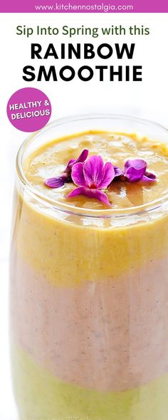 a smoothie in a jar with purple flowers on top and text overlay reading sip into spring with this rainbow smoothie