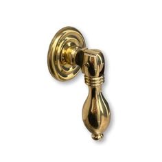 an antique brass door handle on a white background