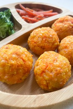 four balls of food on a wooden plate