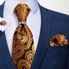 The Spruce Collection is a stand out collection. It's for the professional man in your life. It features a classic paisley design pattern. To add a little pop to your black or blue suit, this set also includes a standard size matching pocket square and cufflinks. As an added bonus, this set also includes tie ring that is covered in meticulously selected crystals in a prong setting and polished to ensure a brilliant shine. Specifications Ties Type: Neck Tie SetSize: One SizeModel Number: JZ04-098 Speaking Engagement, Tie Ring, Luxury Ties, Necktie Set, Ties For Men, Tie Pattern, Paisley Tie, Red Paisley, Tie Styles