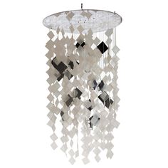 a chandelier made out of squares and cubes hanging from it's ceiling