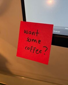 a red sticky note with the words want some coffee written on it