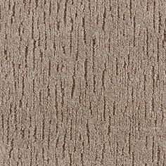 a beige carpet textured with small ridges and lines in the center, as well as an area for text