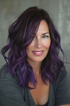 Midnight Purple hair is a mesmerizing choice for those daring to make a bold statement. See more options below. Purple Glaze Hair, Purple Toner On Brown Hair, Edgy Purple Hair, Grayish Purple Hair, Brunette And Purple Hair, Purple Color Melt Hair, Purple Dark Hair, Dark Hair With Purple Highlights, Dark Brown Hair With Purple Highlights