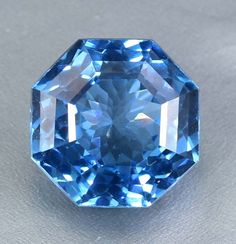 a blue diamond sitting on top of a table