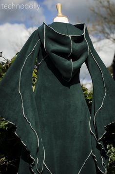 ~ Haunted Hawtin Cloak ~ The floor length Haunted Hawtin Cloak is a simple & beautiful design. Made using soft fleece fabric with elegant trim detail to create a delicate flowing line of colour & form. It is floor length with large medieval flared sleeves, a open front with a single clasp fastening at the throat & rounded hood. Please let me know which clasp you would like when placing your order (1,2 or 3). All three styles are available in either silver or antique gold colour (limi Brown Cloak, Green Cloak, Dark Green Coat, Long Brown Coat, Long Green Coat, Wedding Cloak, Gothic Coat, Fair Outfits, Long Black Coat