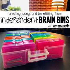 some plastic containers are sitting on a table with the words, creating using and benefiting from independent brain bins