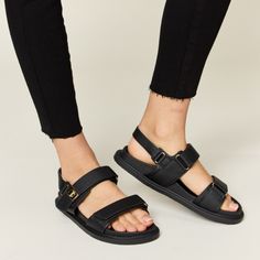 Step Up Your Summer Shoe Game With These Trendy Velcro Double Strap Slingback Sandals. The Double Strap Design With Velcro Closure Offers Both Style And Convenience, Making Them Easy To Adjust For The Perfect Fit. These Slingback Sandals Are Versatile And Perfect For Various Occasions, From Casual Outings To Summer Parties. The Supportive Yet Comfortable Design Ensures You Can Wear Them All Day Long Without Sacrificing Style. Elevate Your Warm-Weather Wardrobe With These Fashionable Velcro Doubl Black Flat Sandals With Adjustable Straps, Black Double Strap Footbed Sandals With Adjustable Strap, Black Synthetic Sport Sandals With Adjustable Strap, Black Sport Sandals With Adjustable Double Straps, Black Sport Sandals With Adjustable Straps And Round Toe, Black Slingback Strap Sandals, Black Strap Slingback Sandals, Black Synthetic Footbed Sandals With Adjustable Straps, Black Sport Sandals With Adjustable Strap For Spring