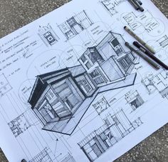 a drawing of a house on top of a piece of paper