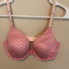 Light Pink Bra With Gray Orange And Bright Pink Stripes. New Without Tags - Little To No Push Up Stretch Multicolor Bra, Pink Seamless Bra For Spring, Pink Bra For Beach In Spring, Pink Padded Stretch Bra, Spring Pink Padded Bra, Pink Stretch Bra With Padded Cups, Stretch Pink Bra With Padded Cups, Pink Underwire Stretch Bra, Victoria's Secret Pink Bra For Spring