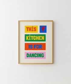 this kitchen is for dancing framed art print on white wall with gold frame and multi - colored lettering