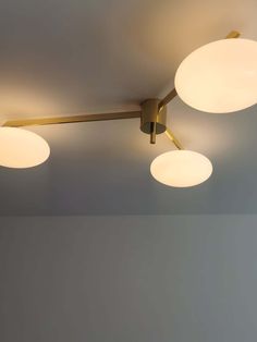 Our versatile Alby Ceiling Lamp is right at home with the casual and refined. Its opal glass shades, shaped like round pearl buttons, suspend from five brass arms for modern appeal. A clean silhouette, that sits flush to the ceiling, is the ideal way to add an extra dose of art deco vibes to bedrooms, foyers, kitchens, and mudrooms. 
 If you have any questions about our products, please contact us and we will get back to you within 24 hours. 
 Product Size 
 3 Heads Size: Dia 113.5cm x H 22.5cm Brass Lampshade, Estilo Art Deco, Mid Century Vintage, Ceiling Lighting, Pearl Buttons, Glass Lighting, Edison Light Bulbs, Ceiling Lamp, Light Bulbs