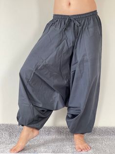 "Harem Pants Ethically Made in Thailand, Low crotch yoga pant, Unisex harem pants, Gorgeous Harem Pants, Lounge & Yoga Trousers Thai Cotton harem pants have the \"flow\", perfect for yoga or just a cool strolling. Comfort and character are what these pants are all about. They have the traditional sarong look & feel but a lot more practical when it comes to activities like yoga. As a bonus, they are convertible! Just pull them up and you get yourself a cute jumpsuit in a flash. Together w Relaxed Fit Harem Yoga Pants, Relaxed Fit Ankle-length Harem Pants For Yoga, Stretch Harem Pants For Yoga, Ankle-length, Stretch Ankle-length Harem Pants For Yoga, Solid Cotton Harem Pants For Yoga, Loose Fit Harem Yoga Pants Ankle-length, Stretch Harem Yoga Pants, Baggy Harem Yoga Pants, Baggy Ankle-length Harem Yoga Pants