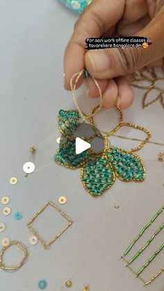 a person is working on some jewelry