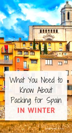 buildings with the words what you need to know about packing for spain in winter on top