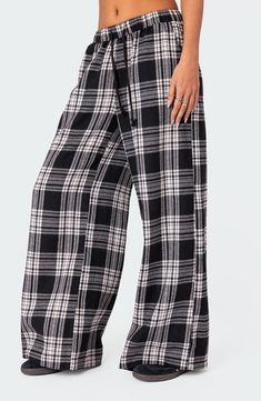 Lounging at home has never looked as good as it does in classic plaid pants cut in a breezy wide-leg silhouette with a comfortable drawstring waistband. Elastic/drawstring waist Front slant pockets 50% cotton, 50% polyester Machine wash, line dry Imported Vintage Hoodies Aesthetic, Plaid Wide Leg Pants, Womens Lounge, Hoodies Aesthetic, Black Pajamas, Plaid Pajama Pants, Night At Home, Cute Pants, Winter Pants