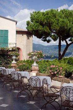 an outdoor dining area with tables and chairs