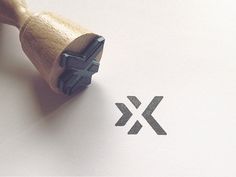 a rubber stamp with the letter x on it